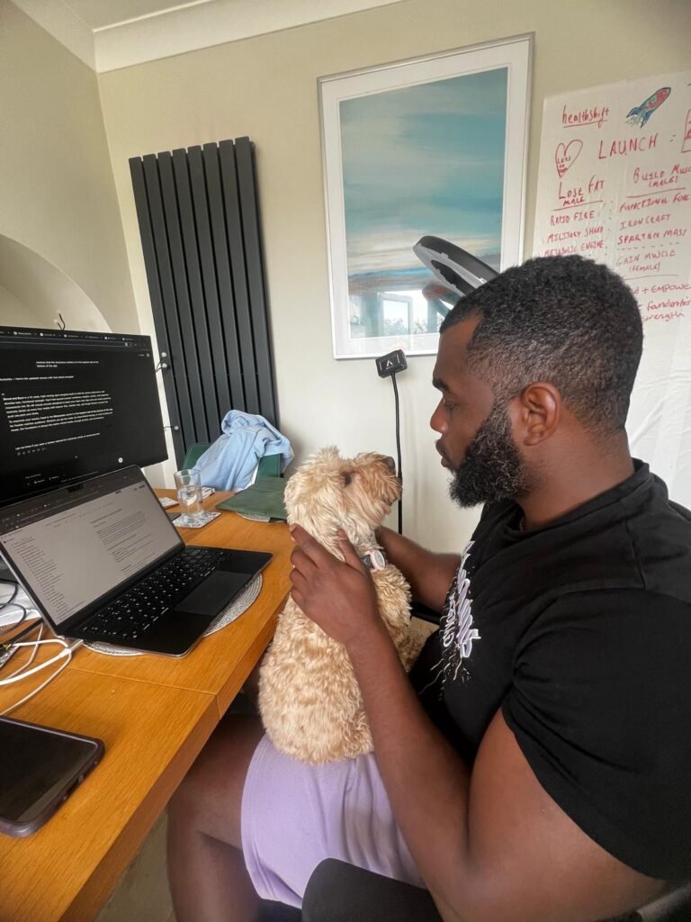 Rash from healthshift working at his desk with Bailey beside him